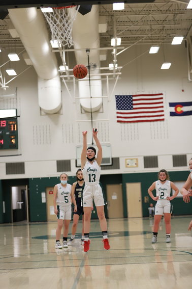 Conifer's Maya Dawson (13) shoots a free throw during the 2021-22 season. Dawson, a senior who also runs cross country and track for Conifer, plans to attend college for journalism.